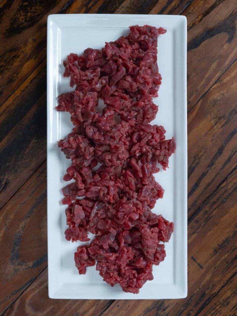 Venison diced for tartare.