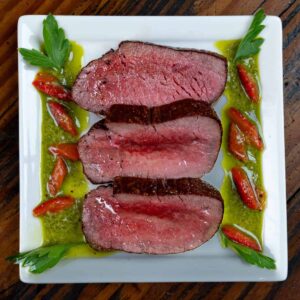 venison steak plated for dinner