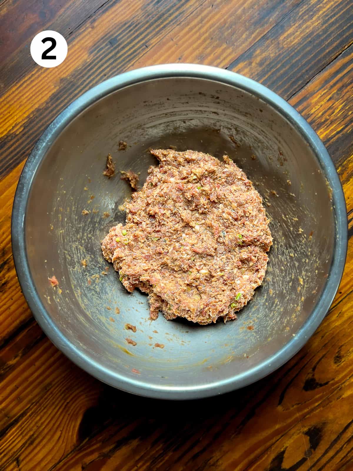 Mixed venison meatball ingredients in a mixing bowl.