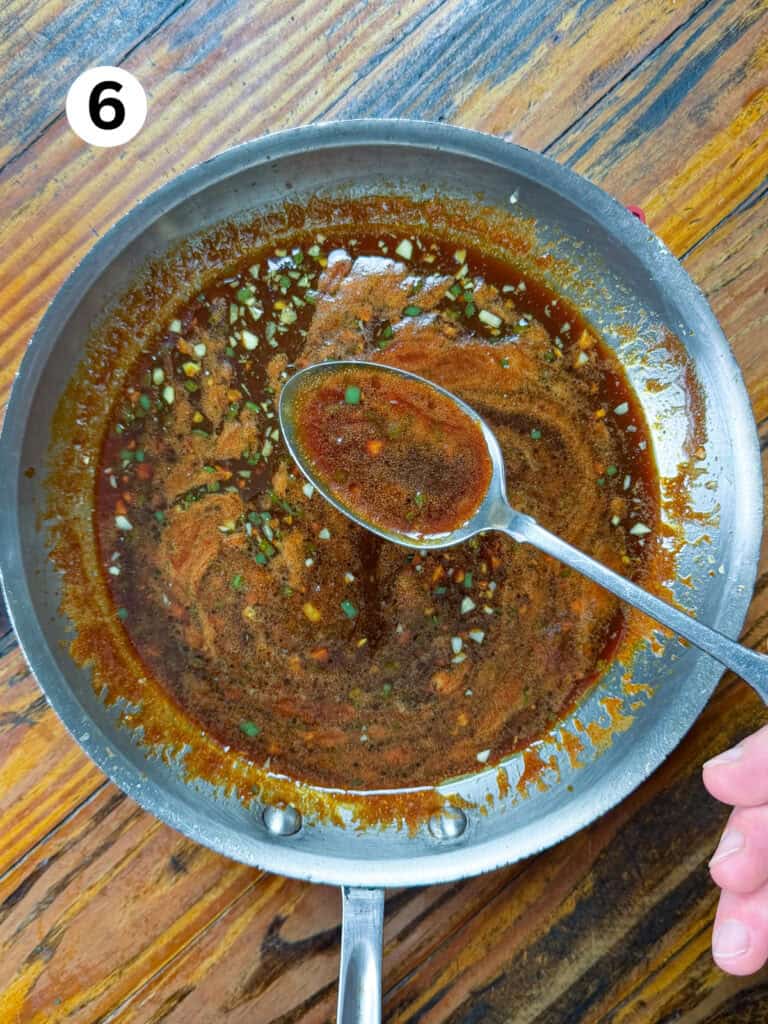 Sauce for venison meatballs in a sauce pan.