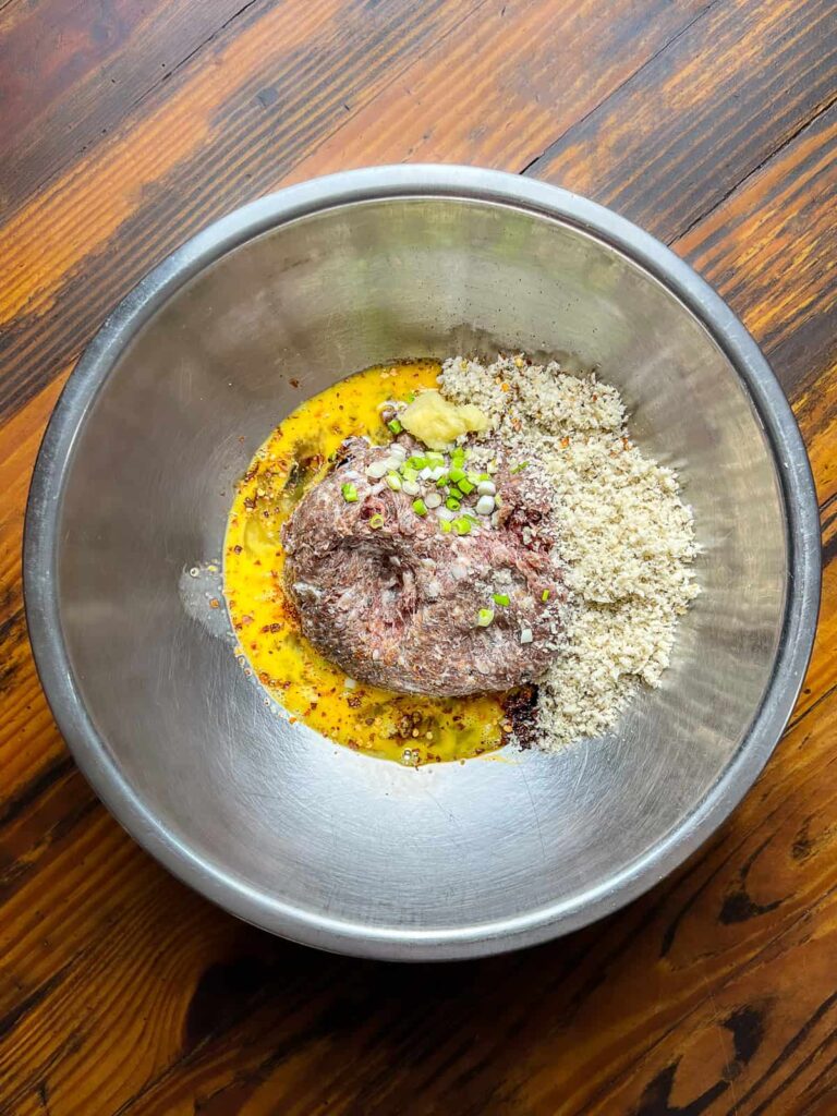 meatball ingredients in mixing bowl