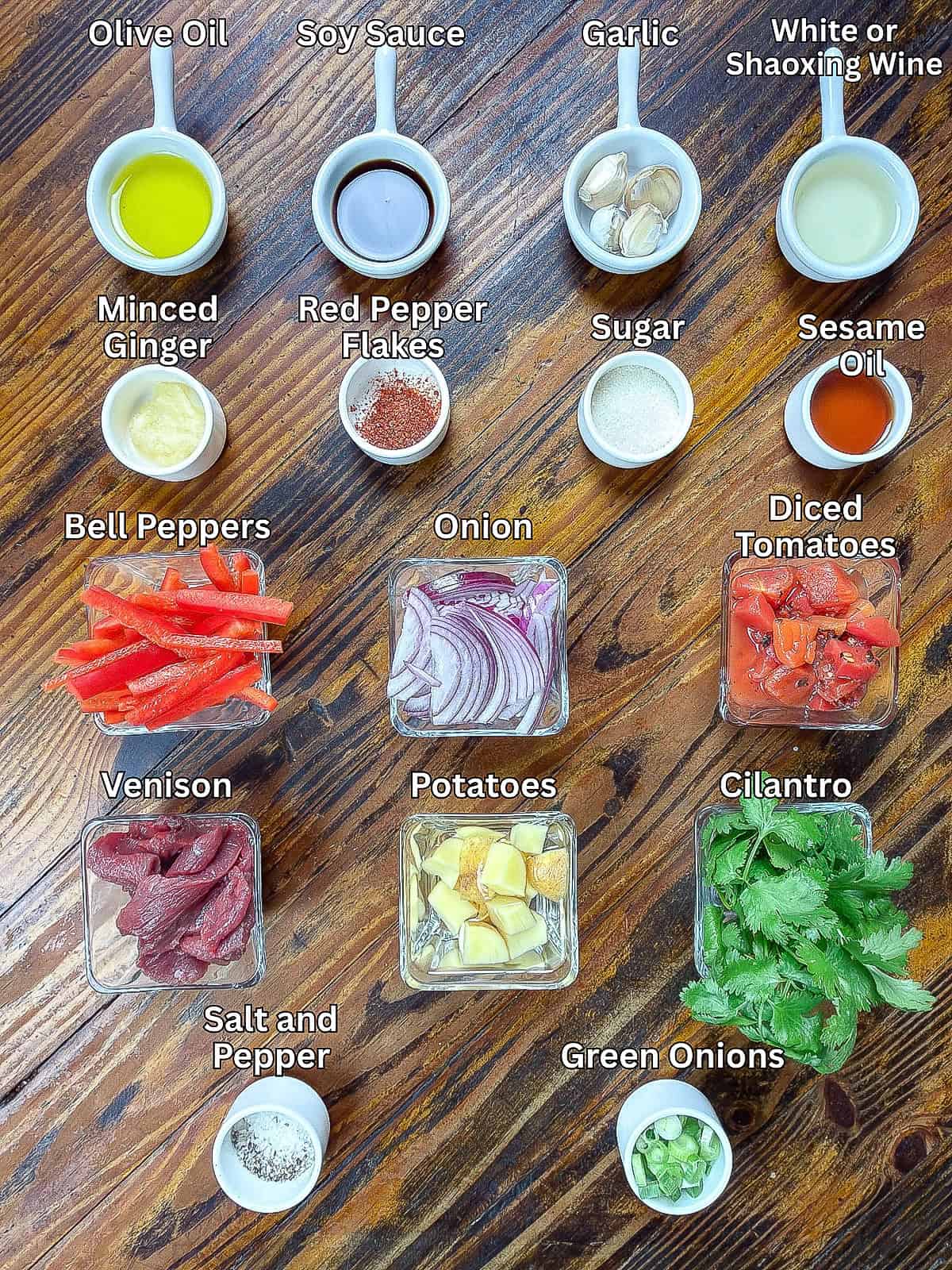 Venison stir fry ingredients on a wooden table.