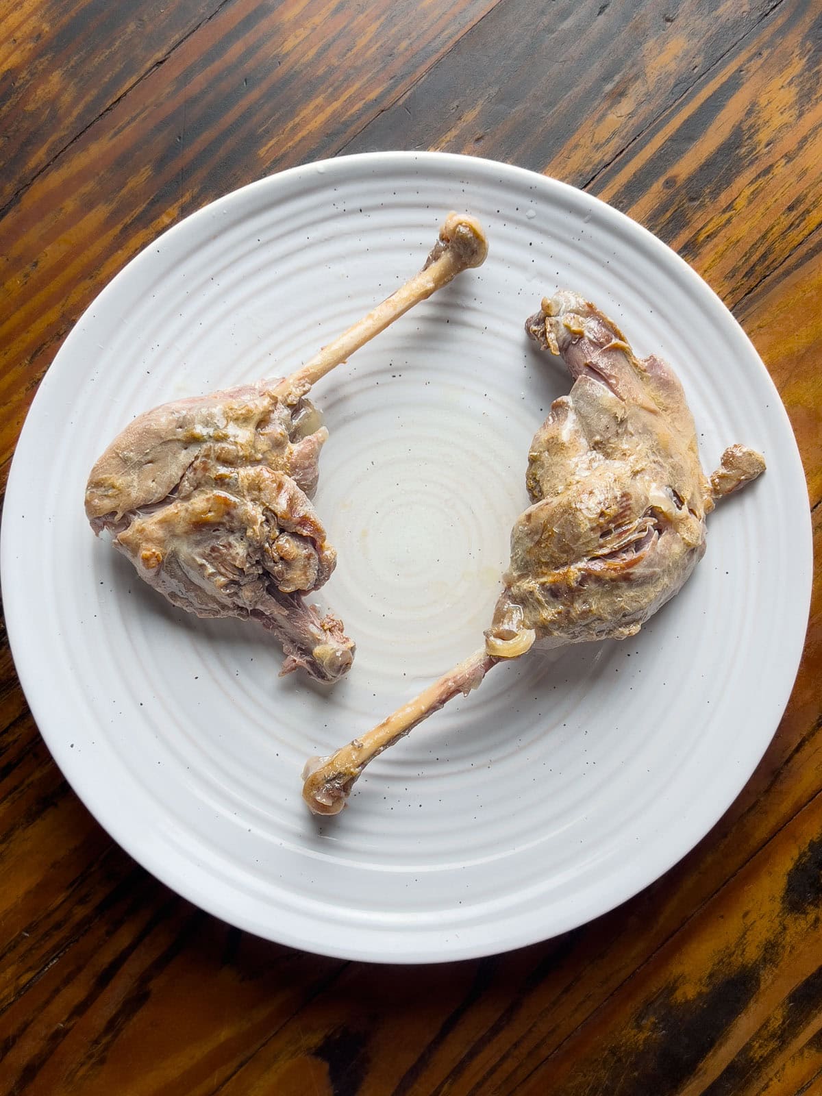 braised goose legs on a plate.