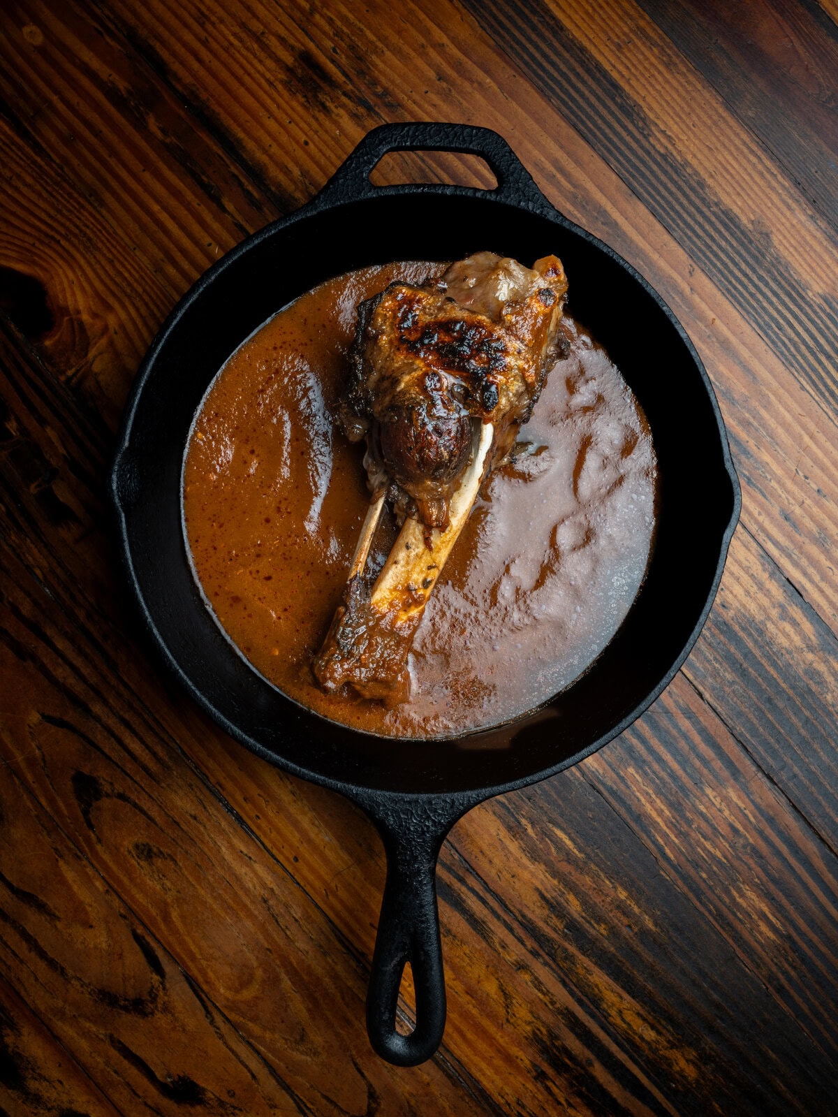 Pork Shank in a cast iron pan.