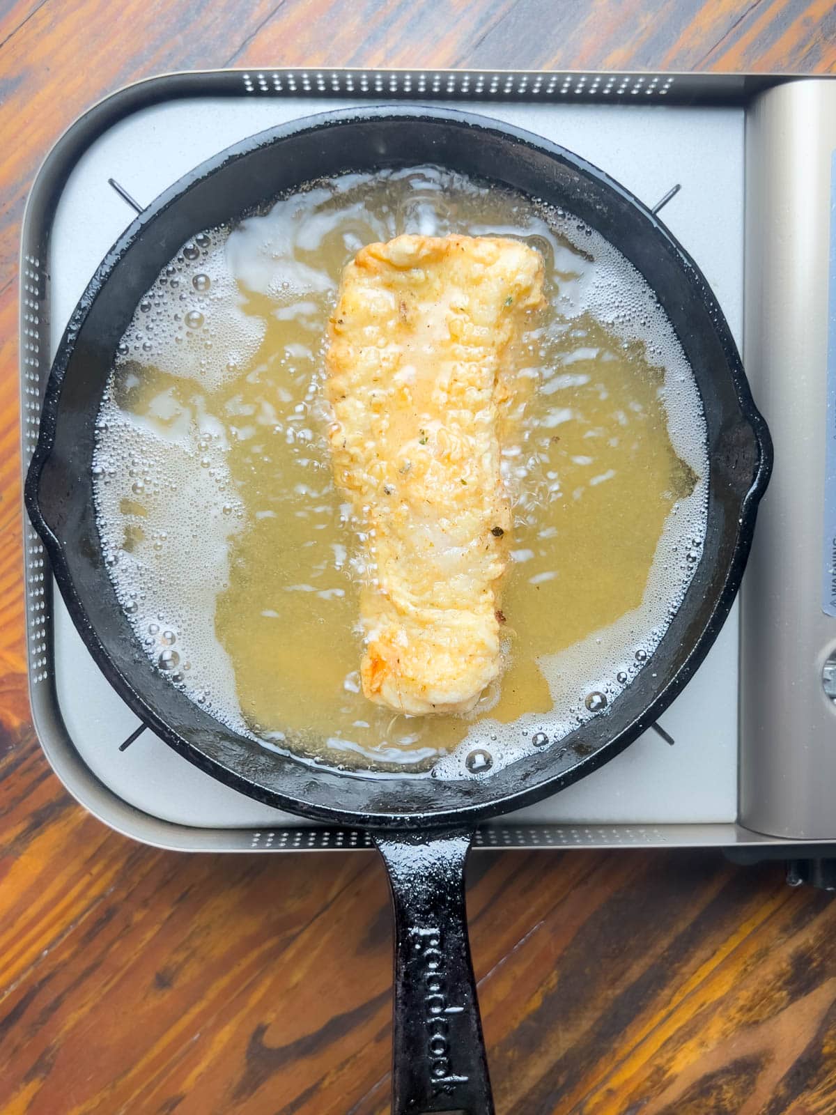 Frying catfish in cast iron.