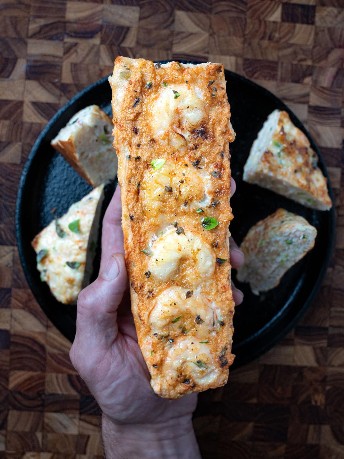 Fried shrimp toast in a skillet.