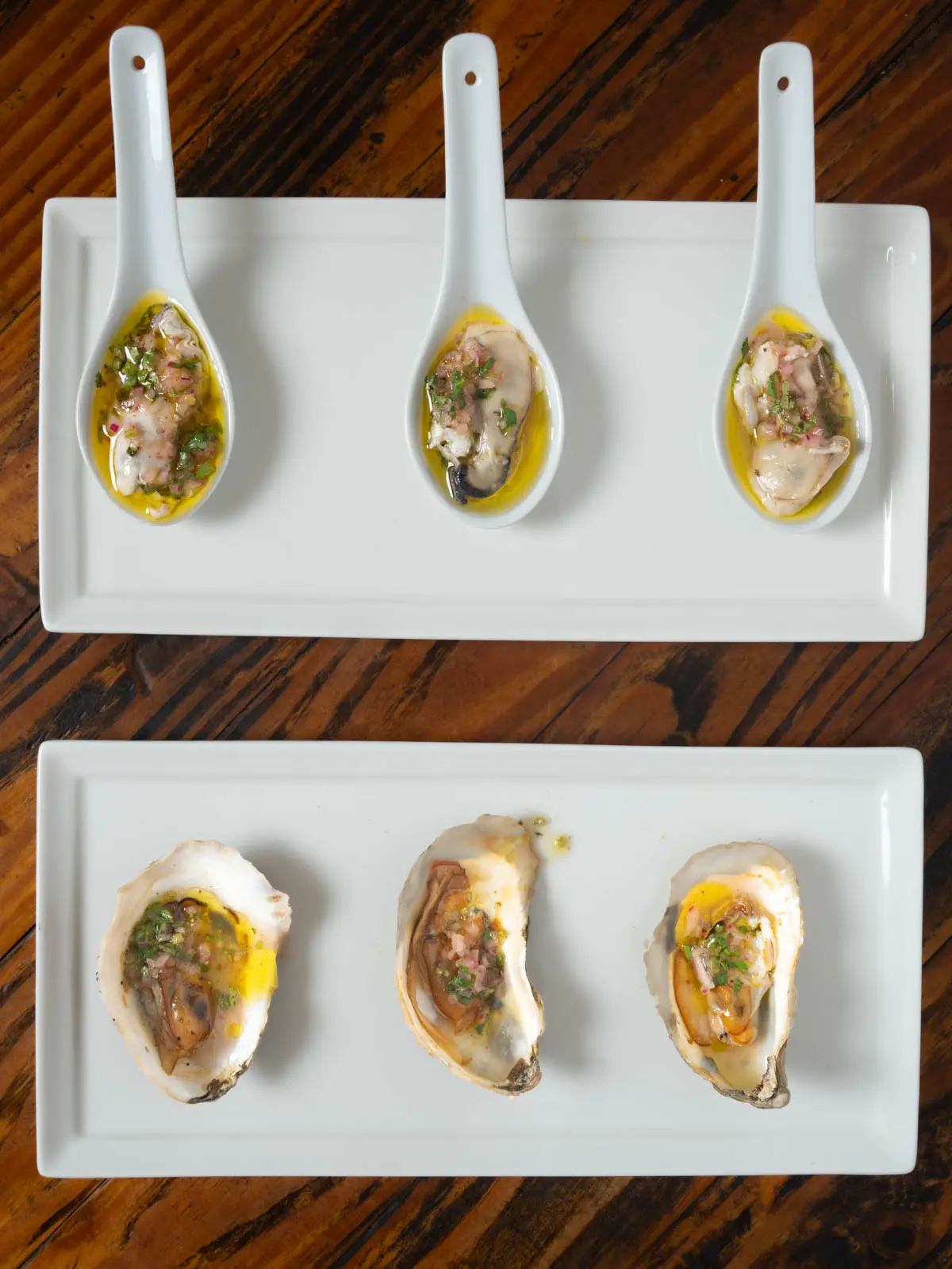 Smoked oysters on serving spoons
