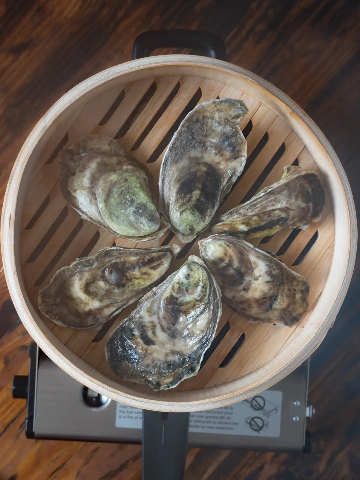 Oysters in a bamboo steamer.