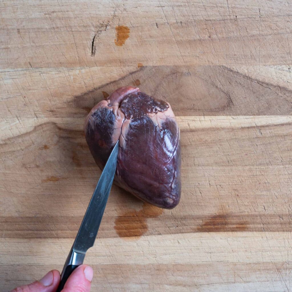 Locating the valve seam of a deer heart.