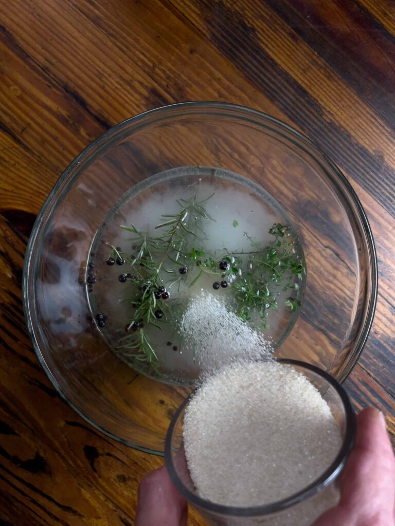 adding ingredients to a mixing bowl.