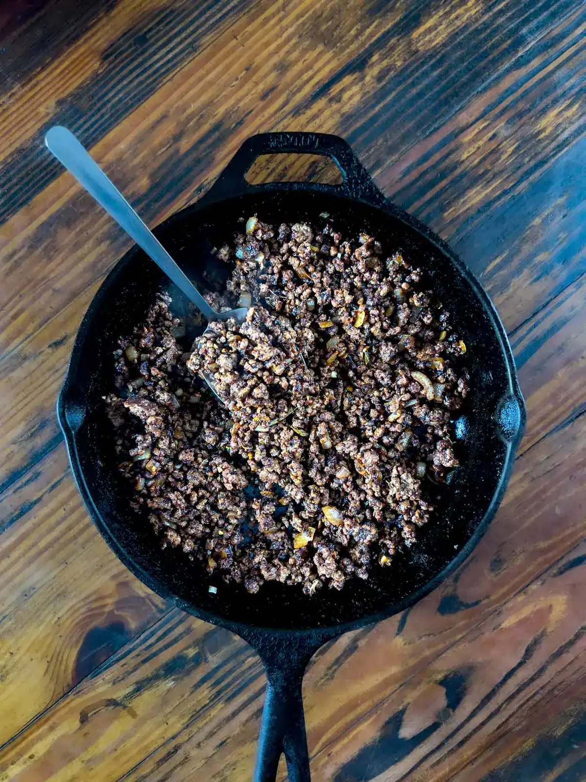 browned meat in cast iron