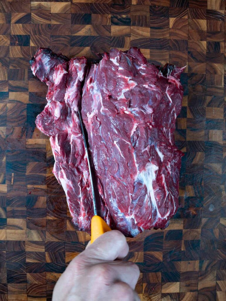 Separating the venison neck bone from the meat.