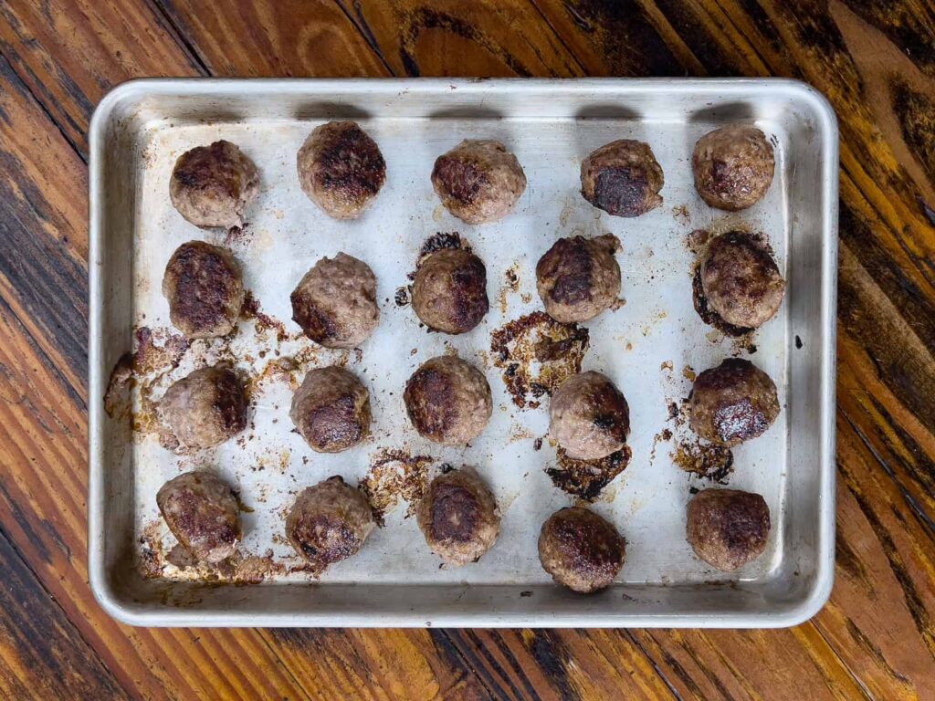 Meatballs on a baking pan.