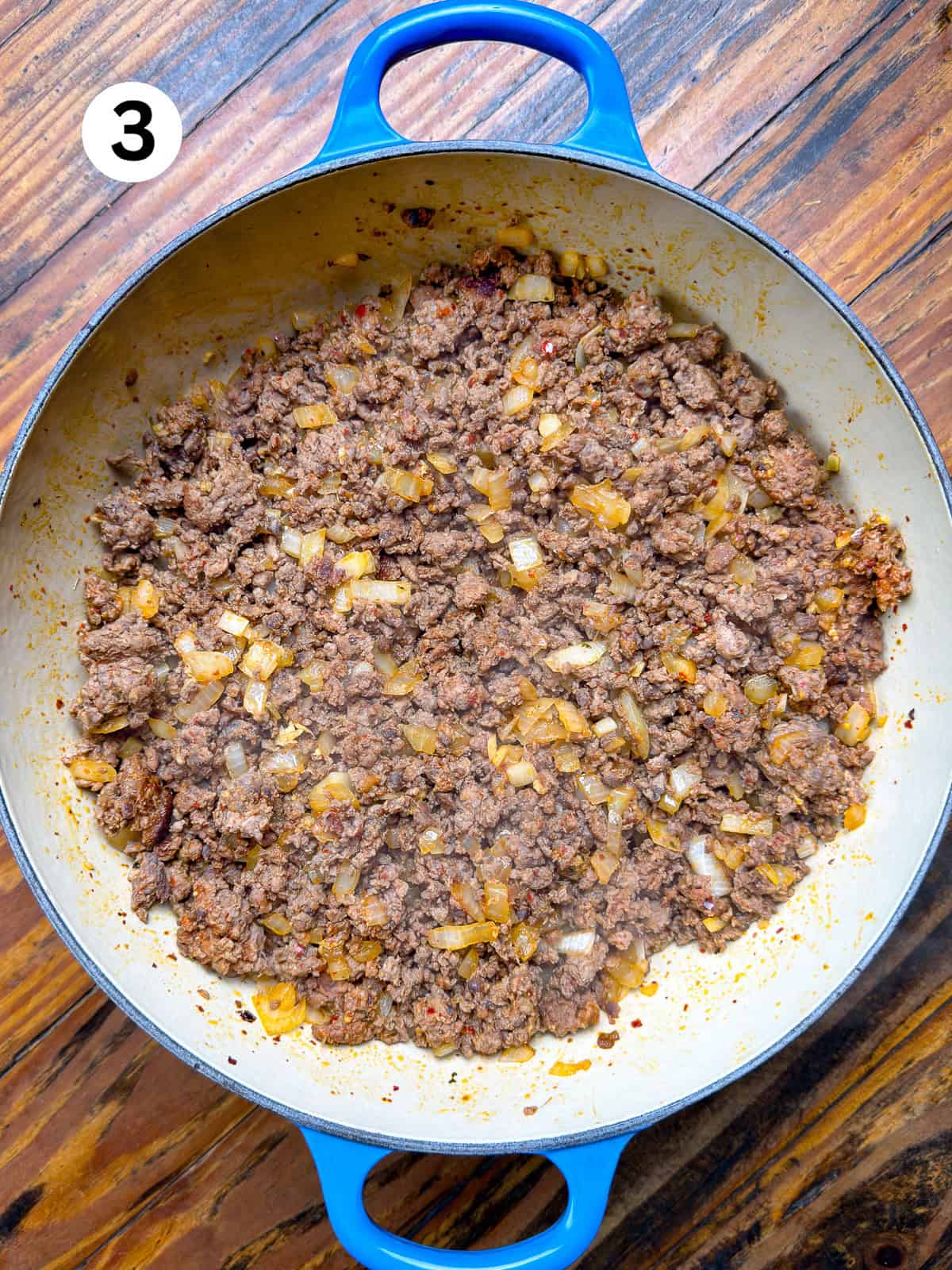 Thai-Fish-Sauce-Dressing Browned ground venison in a pot with onions and garlic.