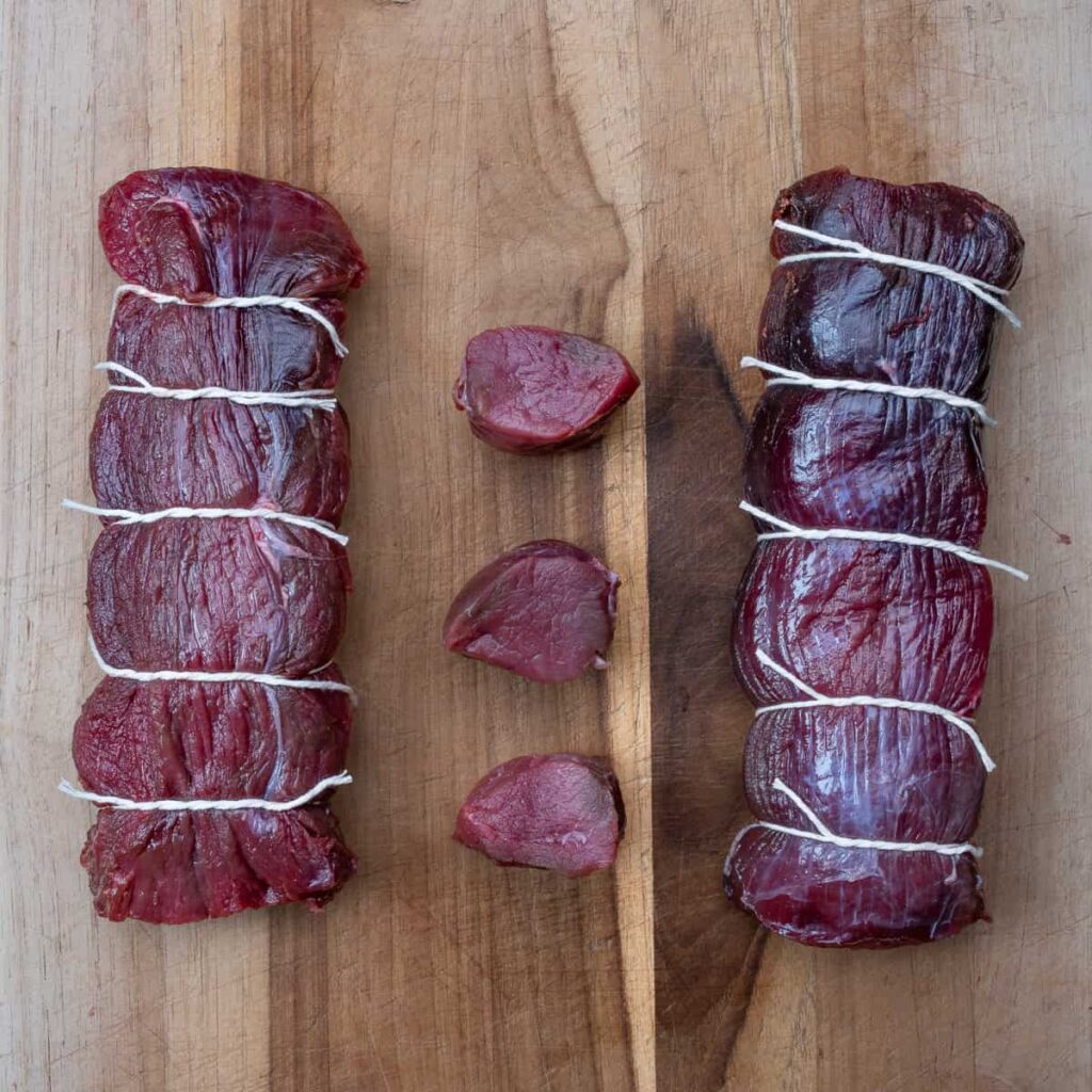 venison round steaks prepped for cooking