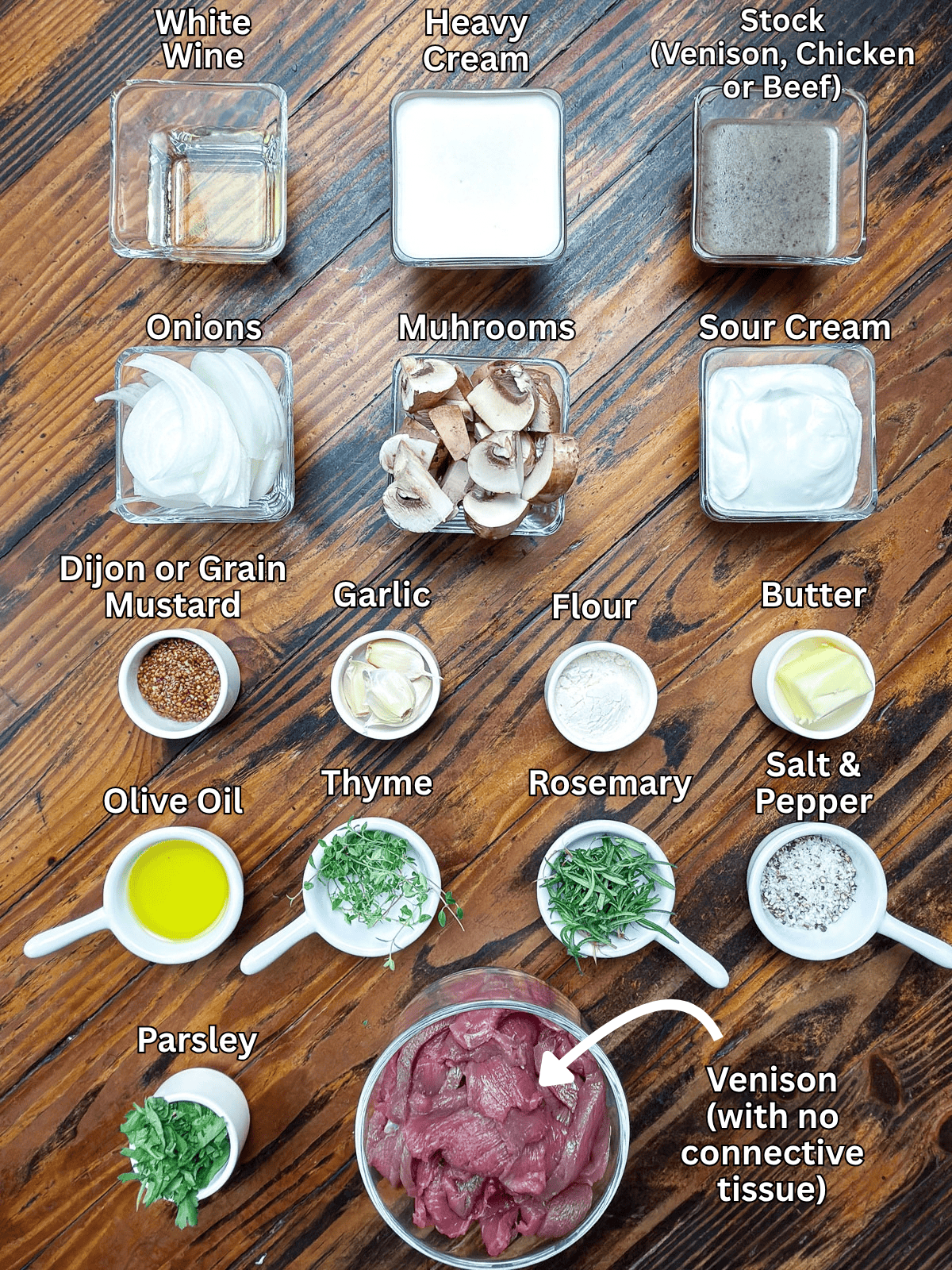 Ingredients for venison stroganoff on a wooden table.