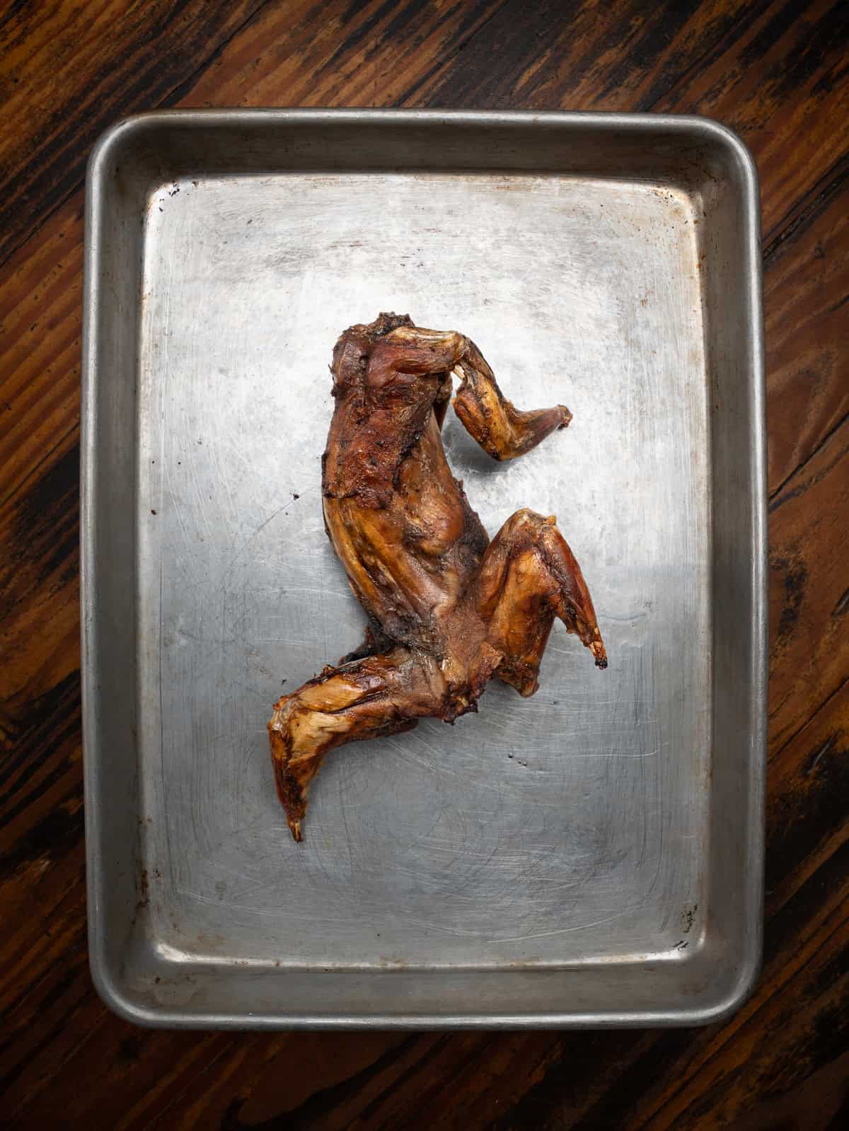 roasted squirrel on a baking pan.