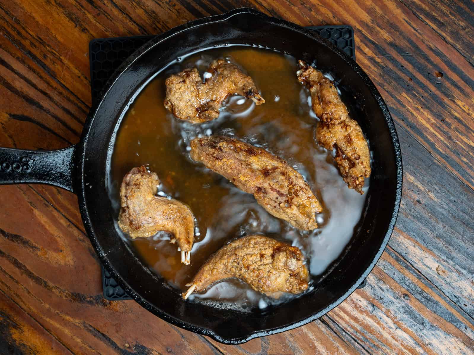 Frying squirrel in a pan.