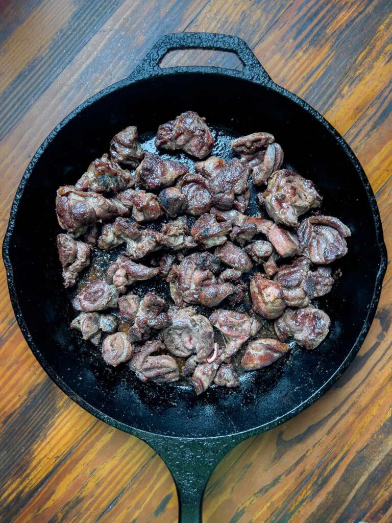 Seared venison in cast iron pan