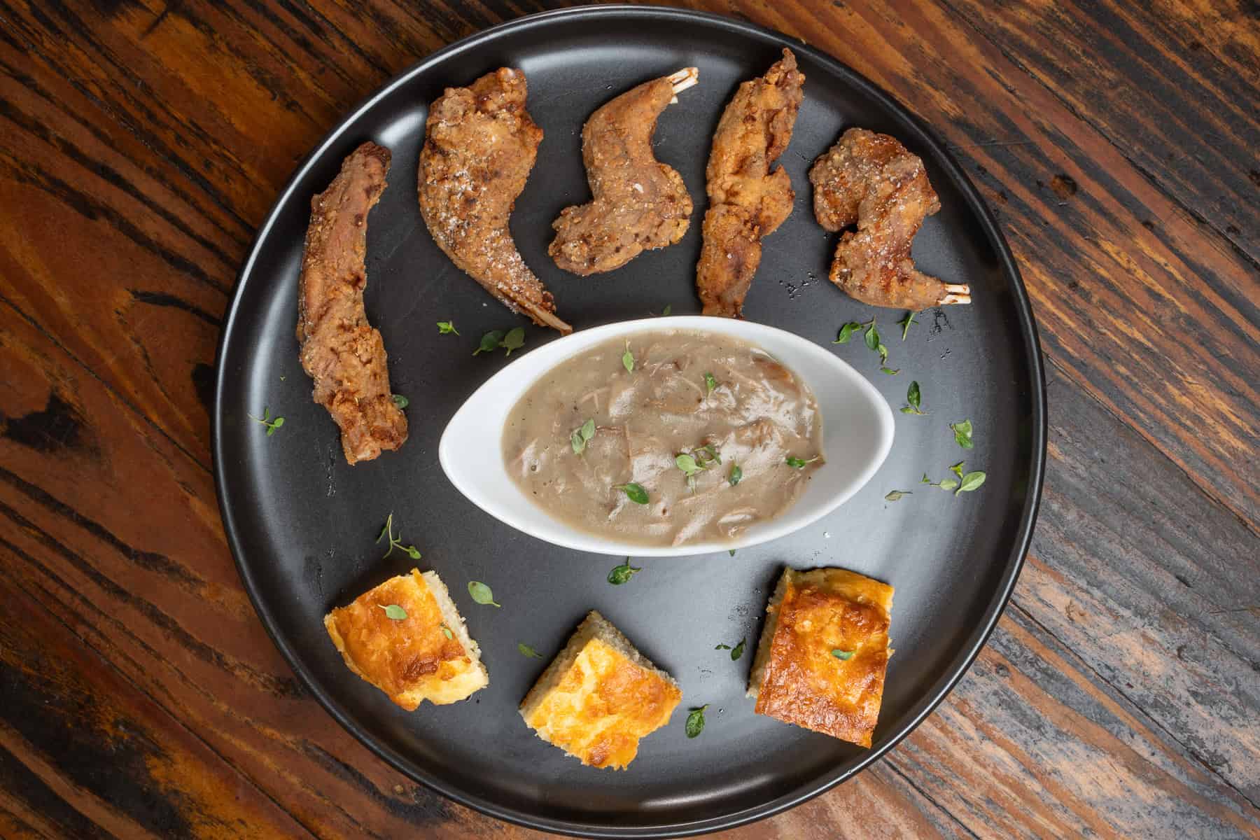 Fried squirrel with squirrel gravy and homemade biscuits.