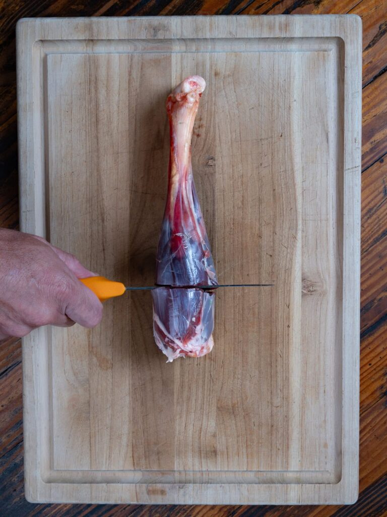 Venison shank cut with a knife.