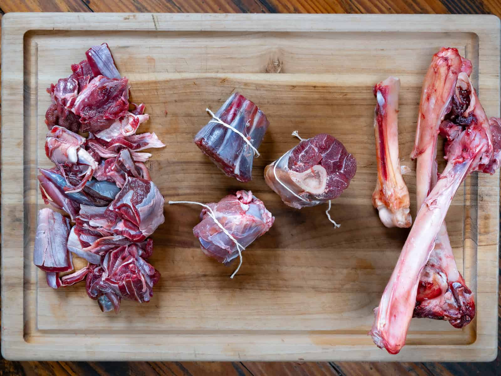 venison shanks on a cutting board.