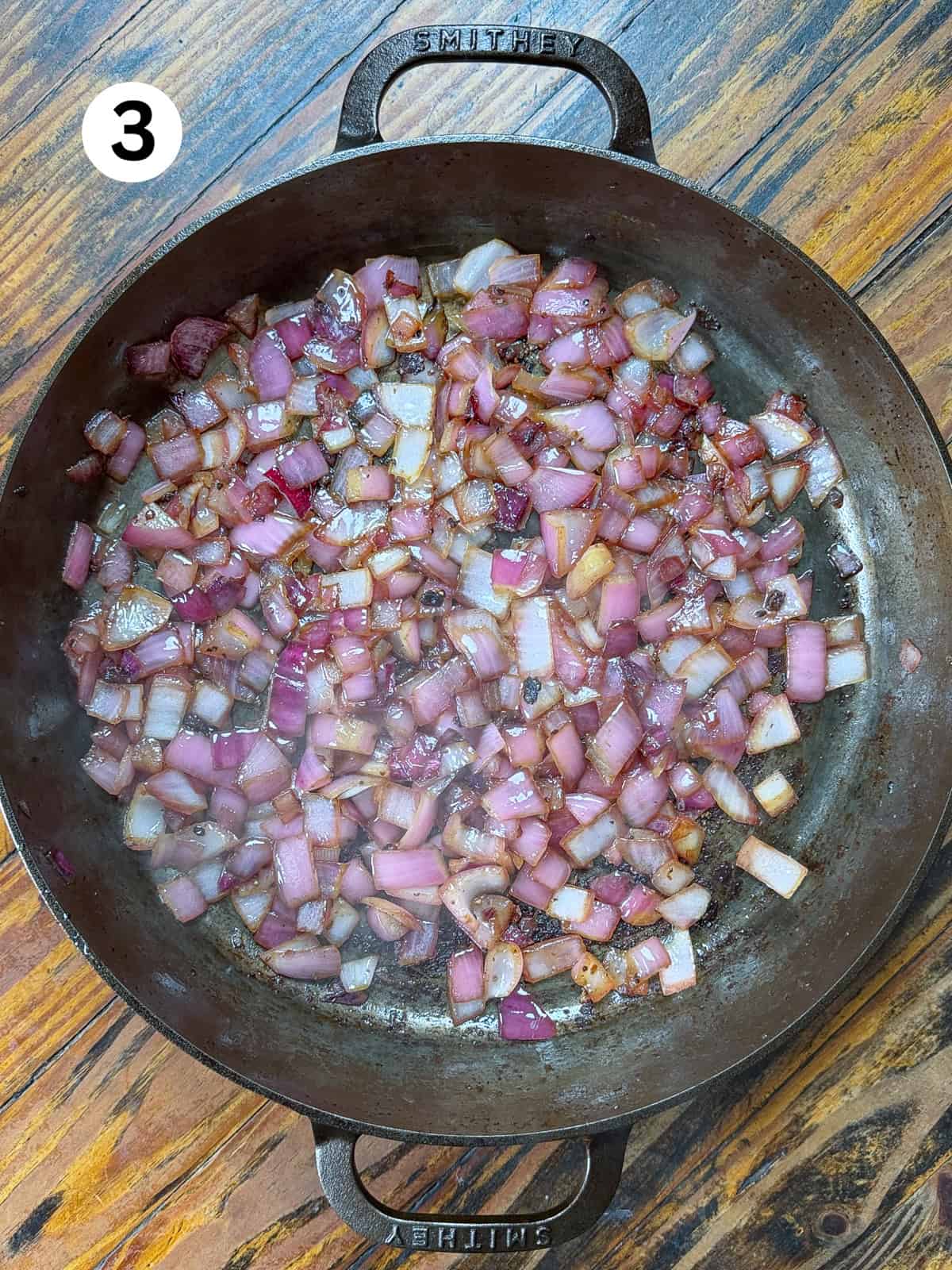 Thai-Fish-Sauce-Dressing Sauteed onions and garlic in a cast iron pan.