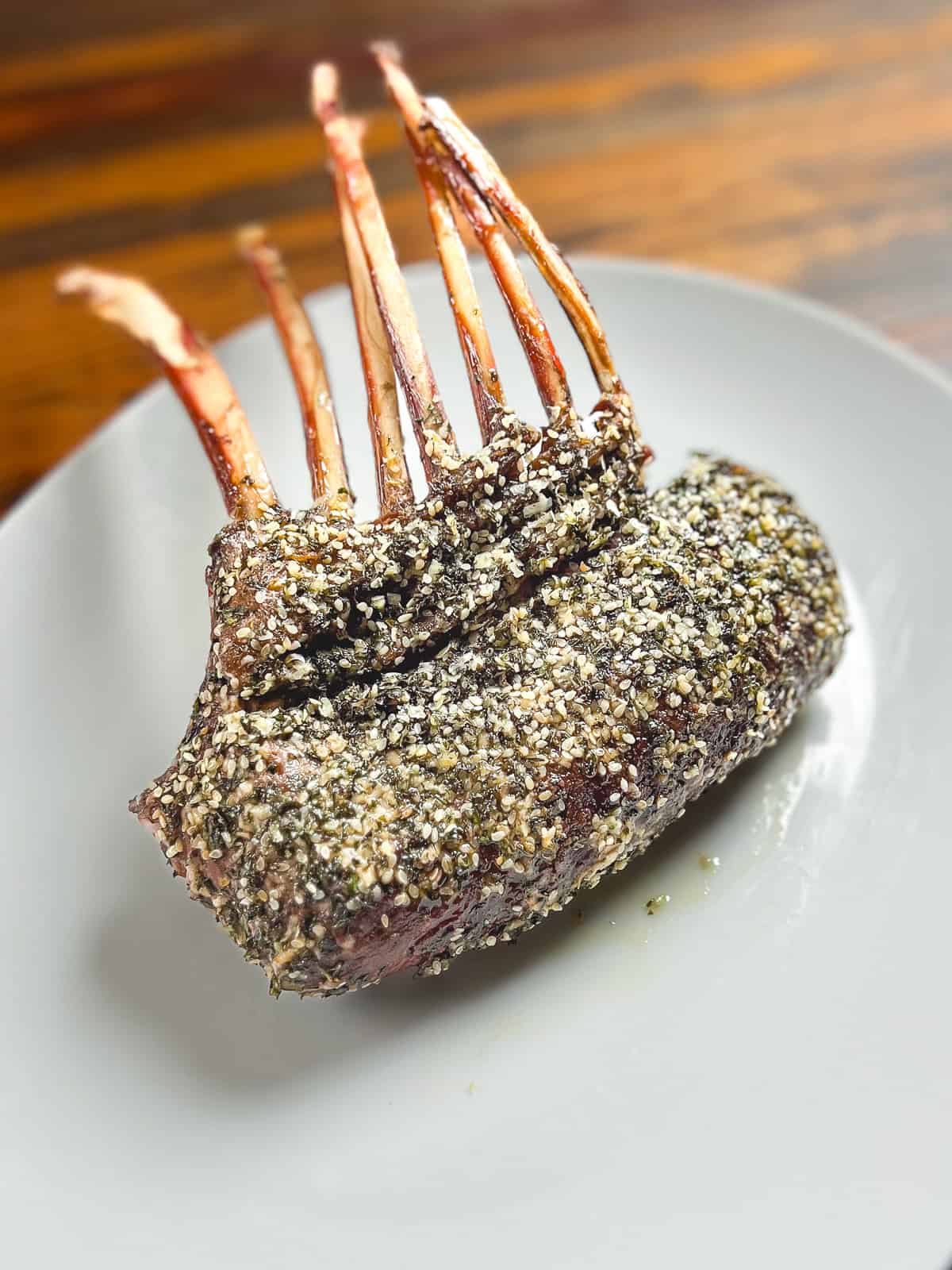 Cooked venison rack resting on a platter.