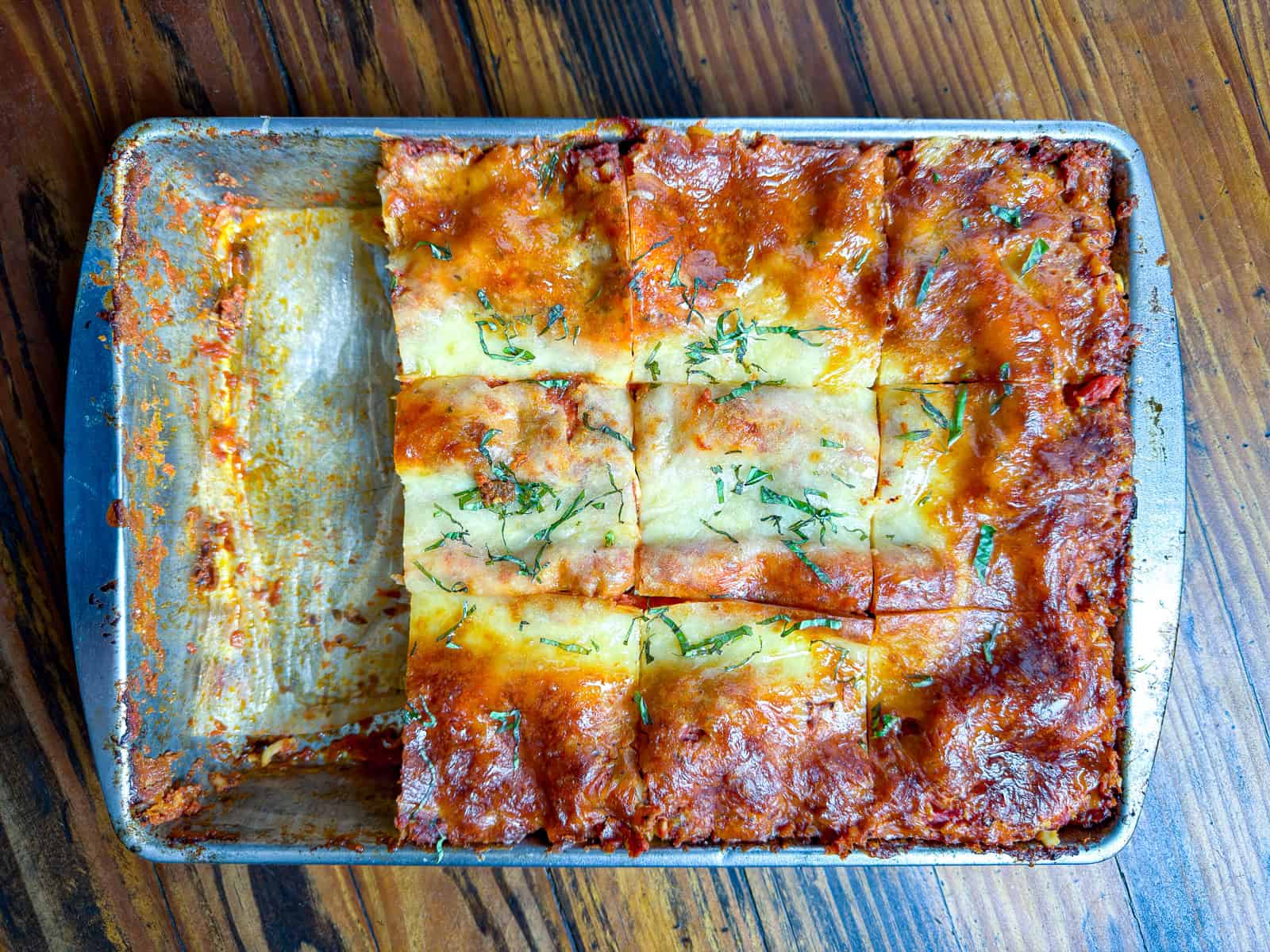 Sliced venison lasagna in a pan.