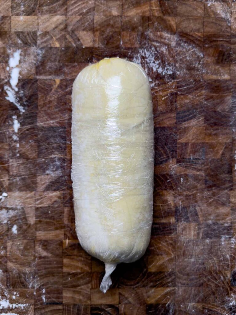 venison wellington rolled in plastic wrap.