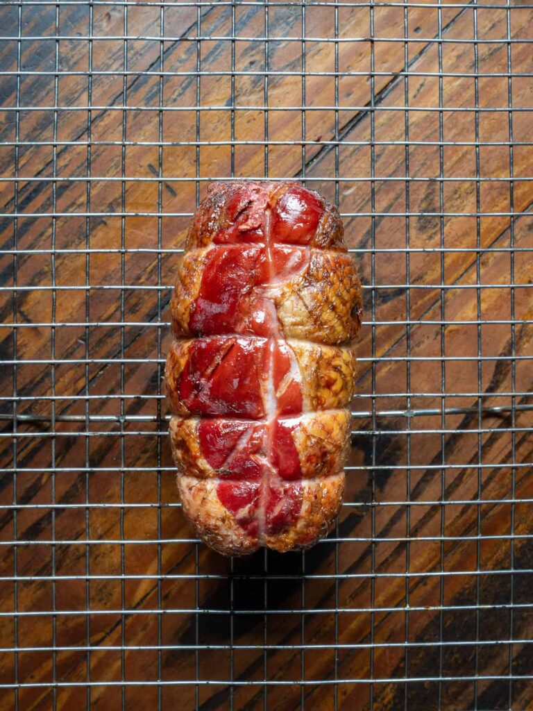 Smoked duck breast resting on a baking rack