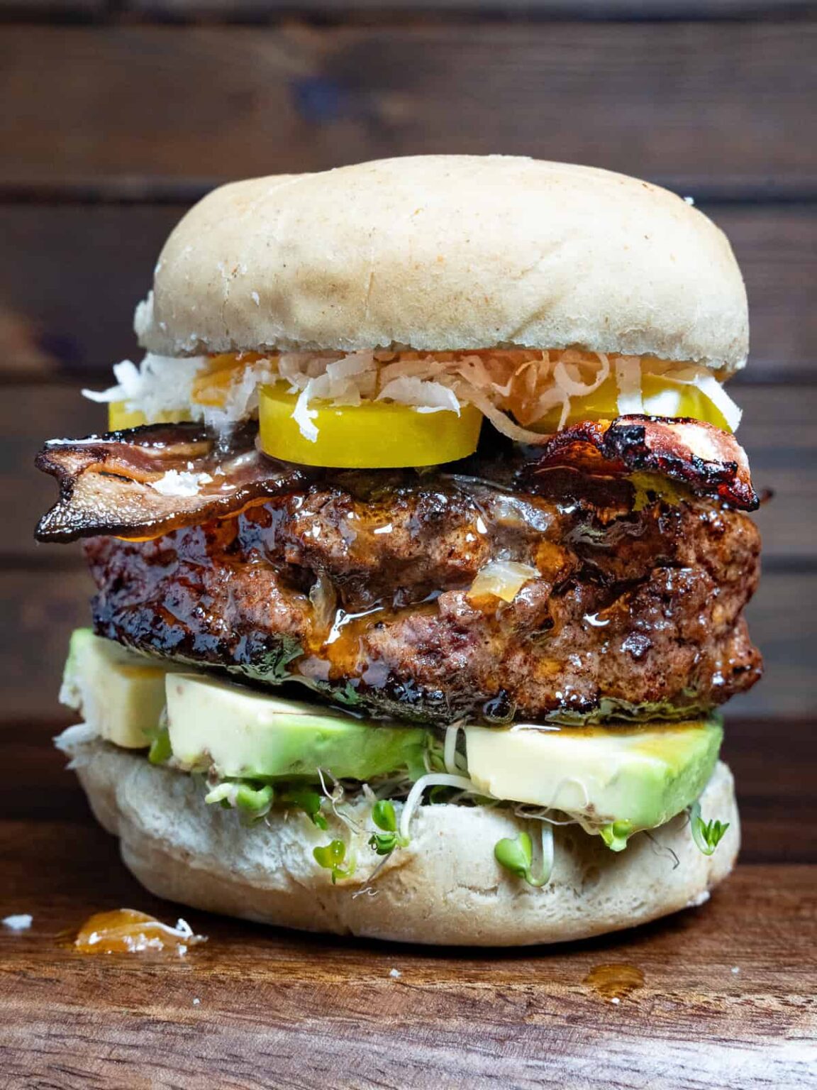 Duck burger on a wooden platter