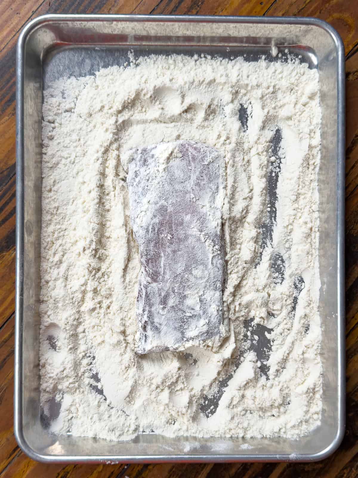 Pork loin coated in flour.
