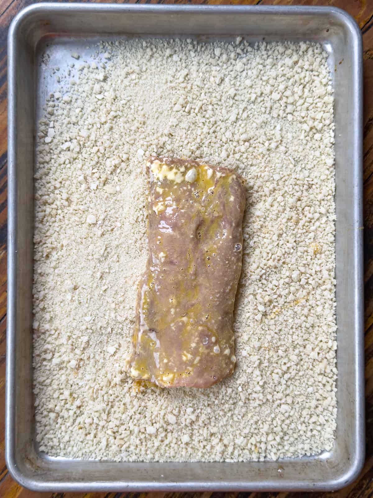 Pork loin resting in panko breadcrumbs