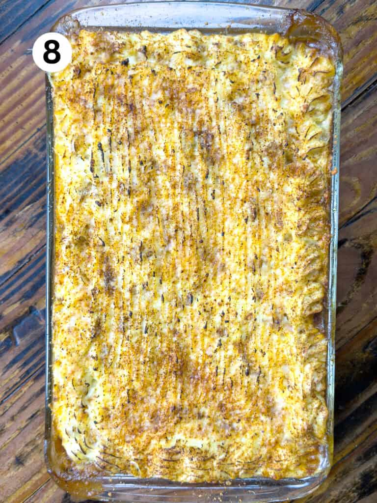 Baked shepards pie on a wooden table.