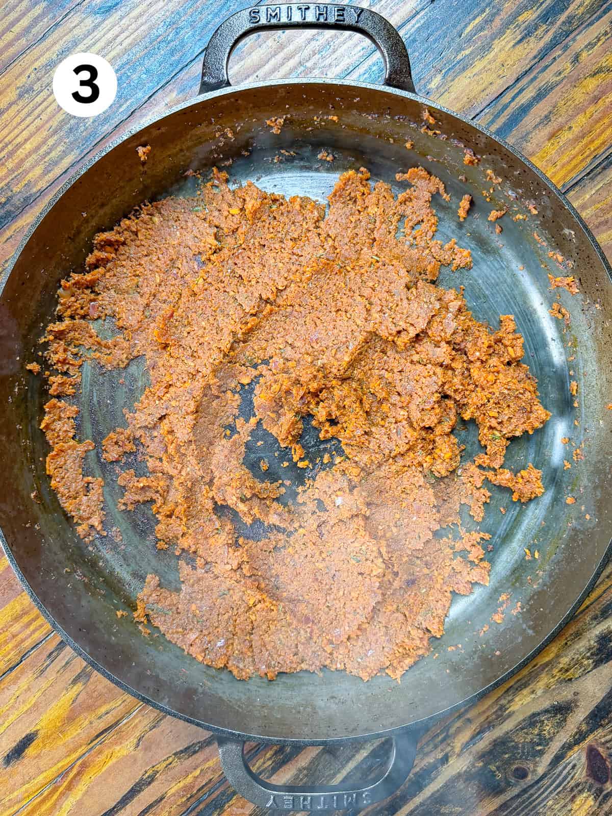 Thai-Fish-Sauce-Dressing Cooked carrots, onions, garlic and tomato paste in a cast iron pan.