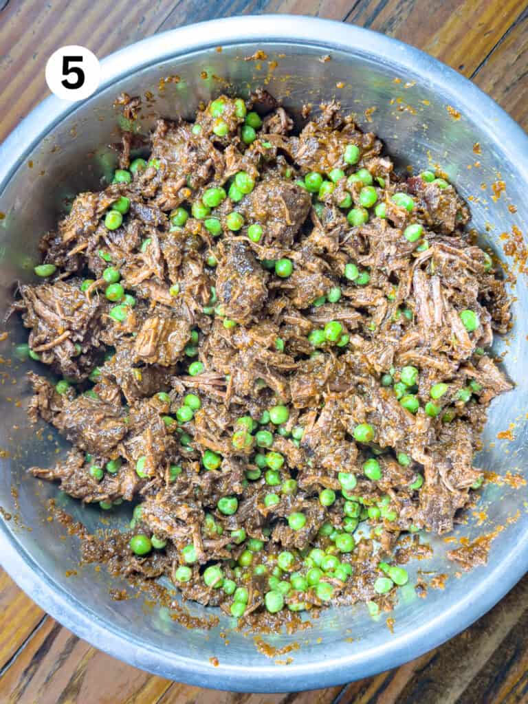 Venison Shepard's pie filling in a stainless bowl.