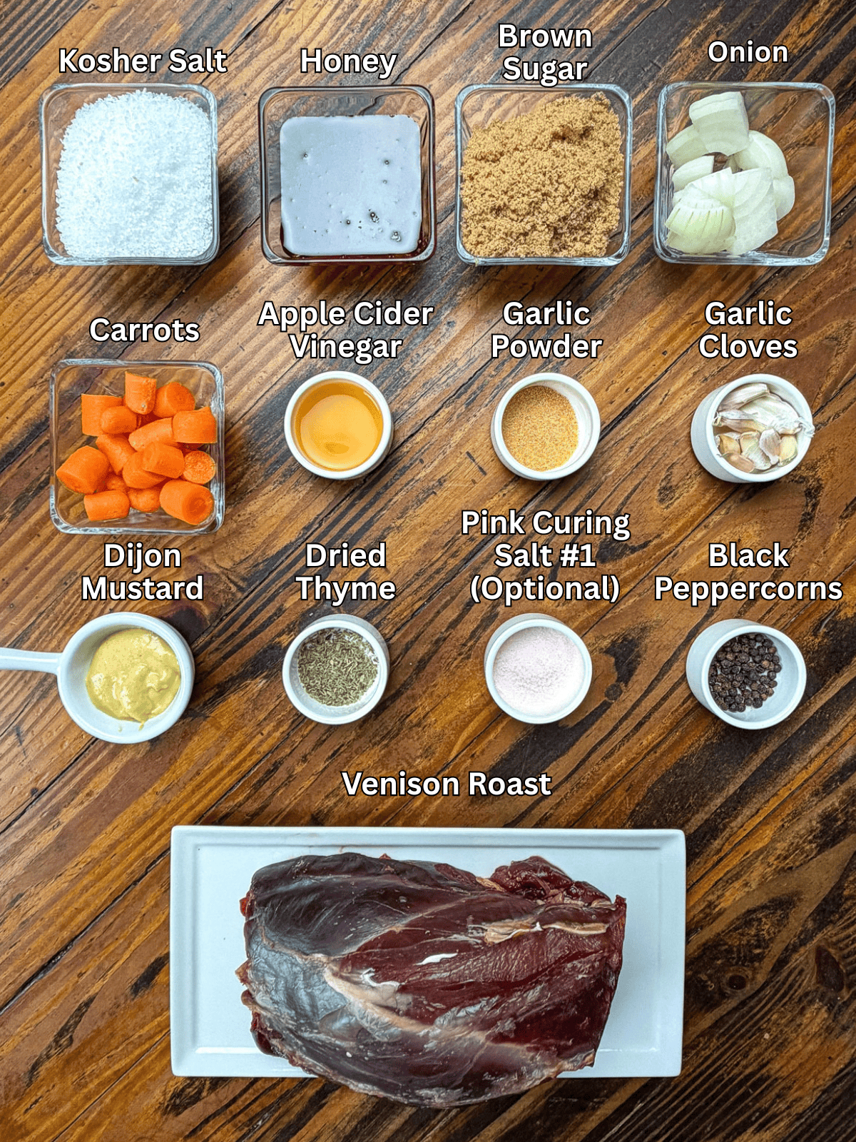 Smoked venison roast ingredients on a wooden table.